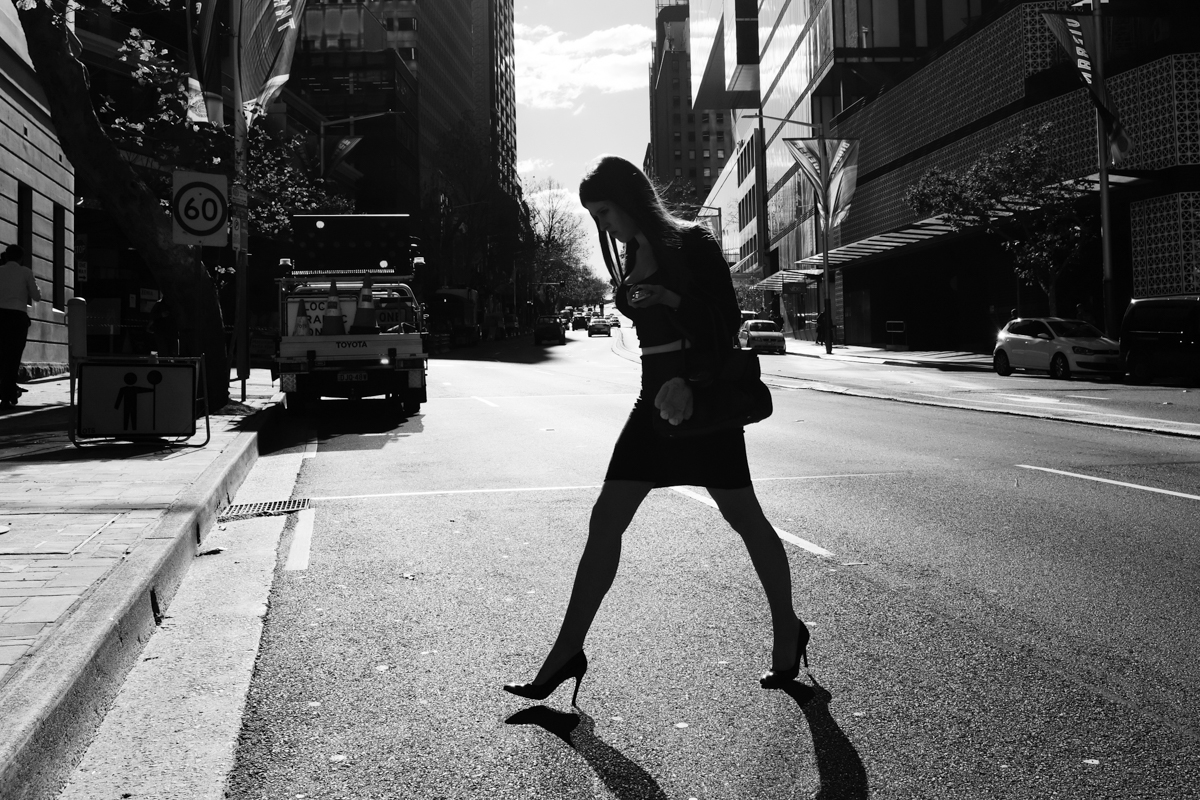 Woman crossing street silhouette